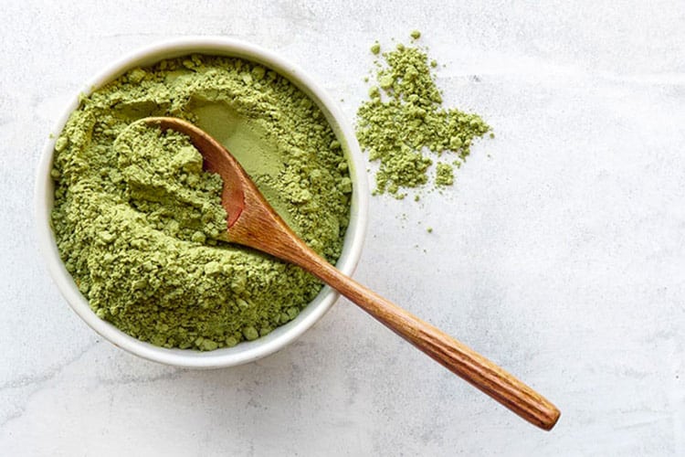 green in bowl with spoon
