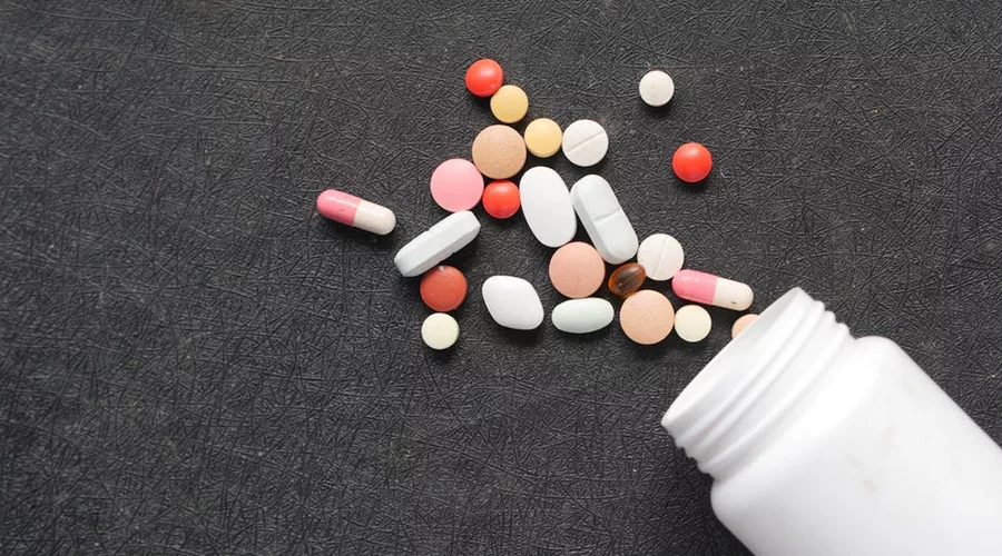 Medication Pills on Black Surface
