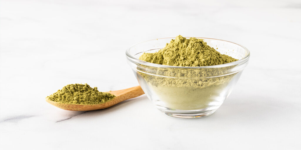 Glass dish filled with Moringa powder