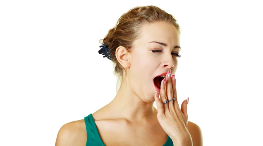 Yawning tired woman