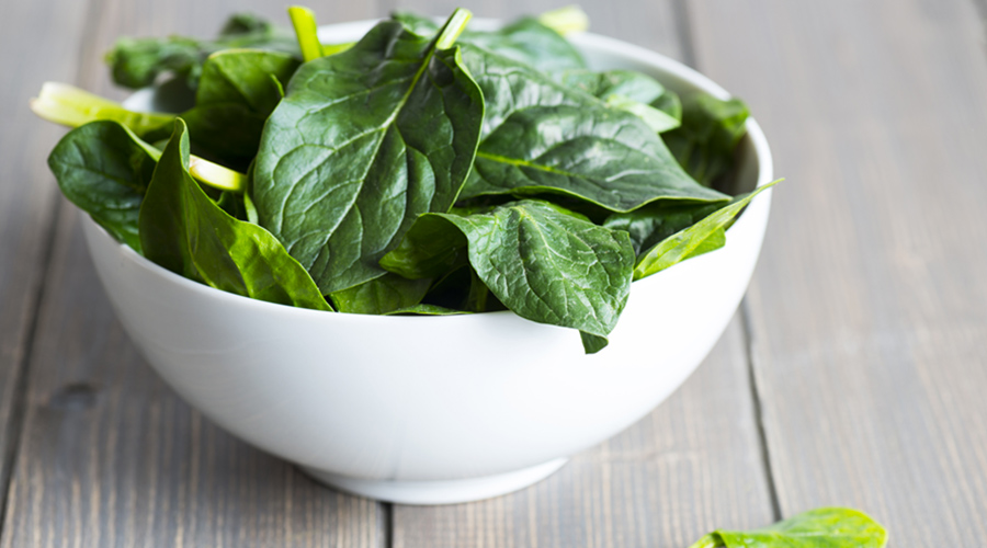 spinach leafs in white bowl