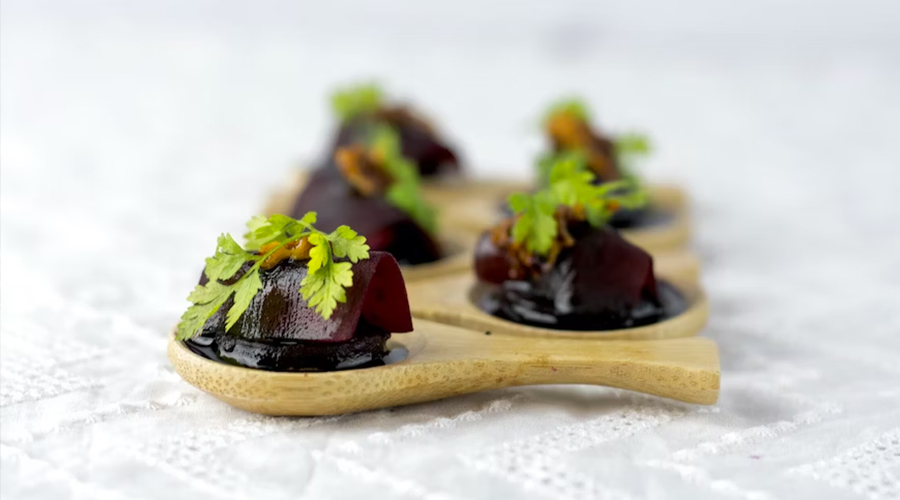 Beetroot sliced on wooden spoons