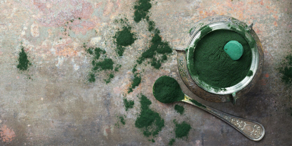 Superfood concept ground green spirulina algae
