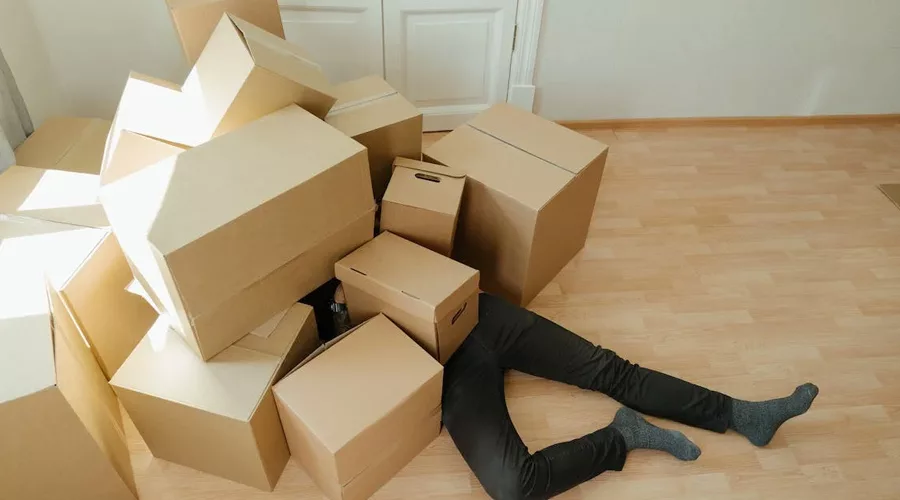 Men Lying on Brown Boxes