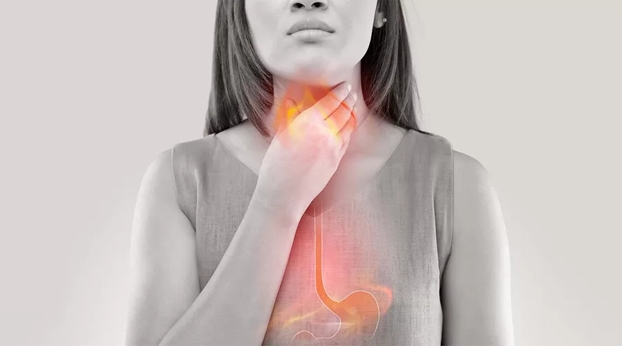 Woman Suffering From Acid Reflux Or Heartburn