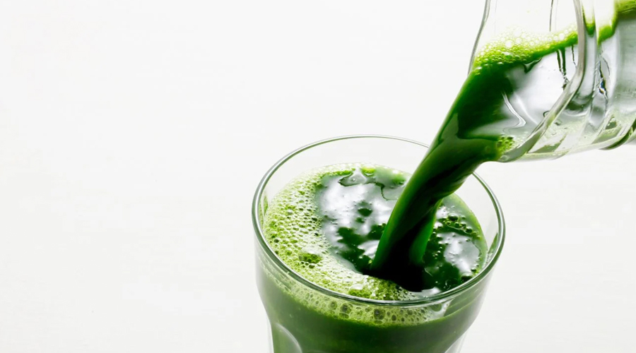glass with green powder